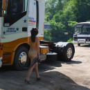 Russian girl undresses next to the truck