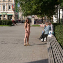 Teen Irina M walks naked at city square