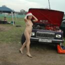 Brunette with nice boobs at exhibition of old cars