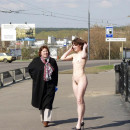 Flat-chested Olga posing naked on the bridge