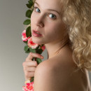 Curly blond with a large wreath