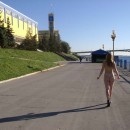 Naked girl with small tits on the waterfront