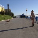 Naked girl with small tits on the waterfront