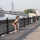 Busty brunette on the embankment in Moscow