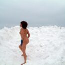 Naked girl in the snowdrifts