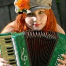 Busty redhead with accordion