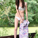 New mode Dama strips in the outdoors as she flaunts her slender body with beautiful   tits.