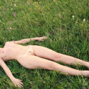 Amateur curly teen posing in the field