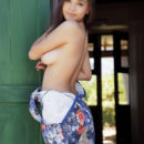 Brunette Li Moon undressing at doorstep