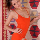 Layna reveals her petite body with small tits and tight ass as she strips her red dress.