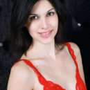 Elizabet strips her red lingerie baring her creamy, white body as she sensually poses in front of the camera.