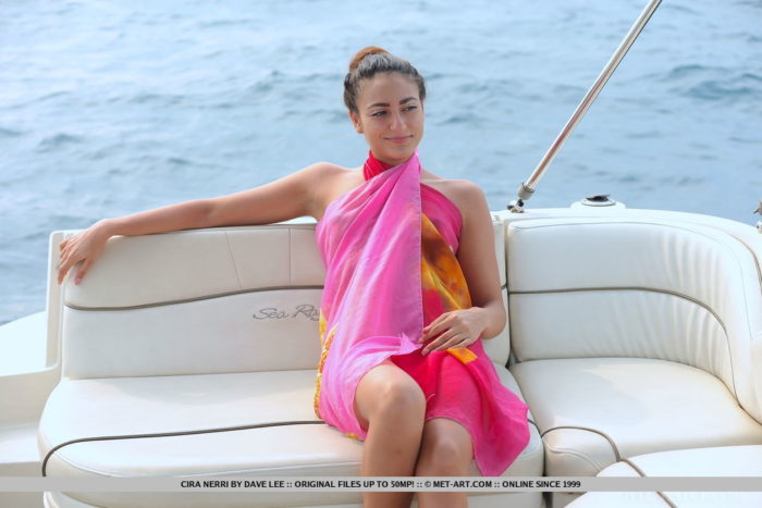 Cira Nerri sensually poses in the yacht as she bares her nubile body with perky tits and sweet pussy.