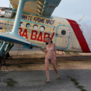 Youthfull russian redhead dame walks nude at small aerodrome