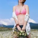 Karolina Young delightfully poses among the flowery field as she bares her amazing body   with delectable tits.