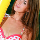 Gorgeous Fernanda on yellow beach mattress