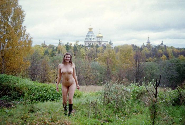 Old photos of naked blonde near old monastery