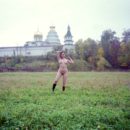 Old photos of naked blonde near old monastery