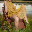 Pammie Lee sensually poses among the grassy field as she bares her curvy body and trimmed pussy.