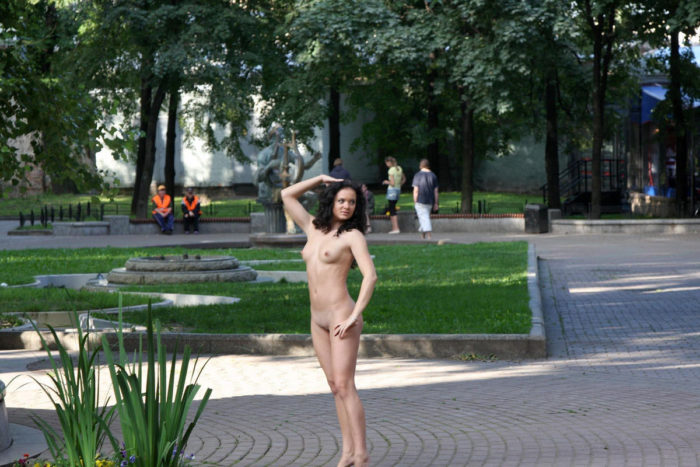 Brunette Vika loves to walk at city park naked