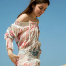 Klarissa playfully poses outdoors as she bares her unshaven pussy.