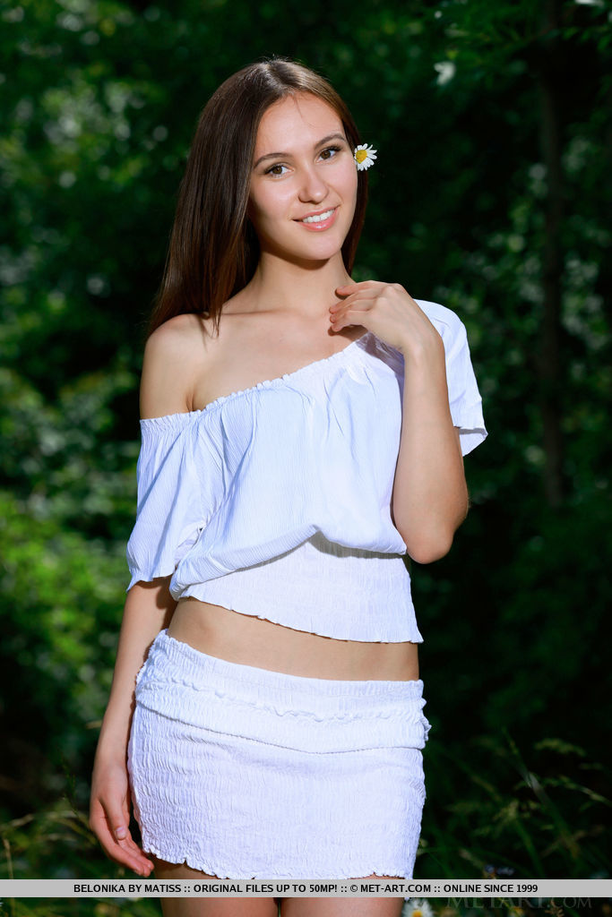 Like a muse or woodland nymph, Belonika's elegant beauty, sweet smile, and nubile body stands out in the verdant surroundings
