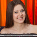 Newcomer Morgan shows off her slender body and smooth pussy on the couch.