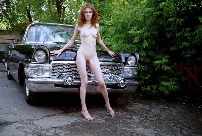 Old photos of beautiful slender redhead in old USSR car