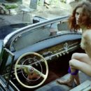 Old photos of beautiful slender redhead in old USSR car