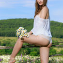 Beautiful Izabel A poses like a fairy in the flowery fields as she flaunts her enchanting   body.