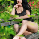 Beautiful Lola Marron playfully poses in the garden as she strips on the chair baring her delectable body.