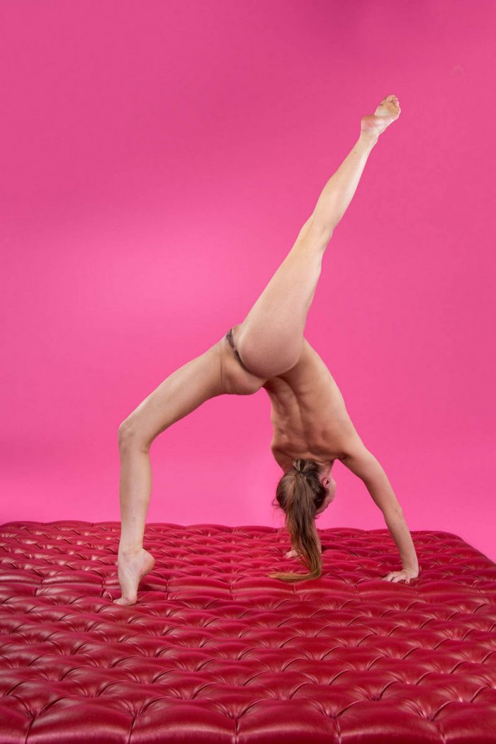 Flexible russian girl in pink room