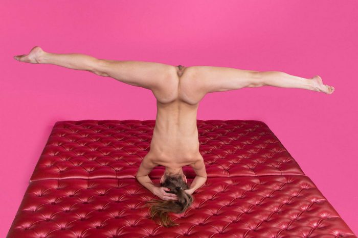 Flexible russian girl in pink room