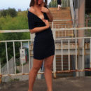 Joyful girl flashes her tits and pussy on public streets