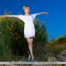 Tiara playfully poses outdoors baring her smooth, cream body.