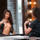 A glamshoot with the sexy Zelda B wearing a leather jacket, sheer black high-waist lingerie, and peep-toe heels