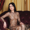 Alluring Sasha Bree spreads her legs wide on the sofa as she flaunts her   delectable pink pussy.