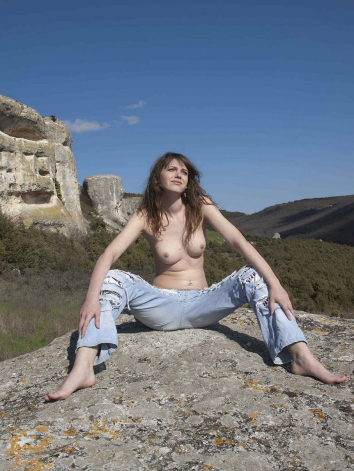 Girl Inessa A in jeans posing at white rocks