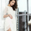 Gorgeous Layna strips her dress on the bed as she flaunts her slender sexy body,   long legs and yummy pussy.