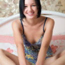 Loreen A shows off her gorgeous body with beautiful breasts and pink pussy as   she poses on the bed.