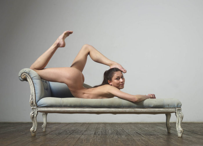 Russian naked gymnast girl widely spreads legs