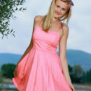 Tais delightfully poses outdoors baring her amazing butt and delectable pussy.