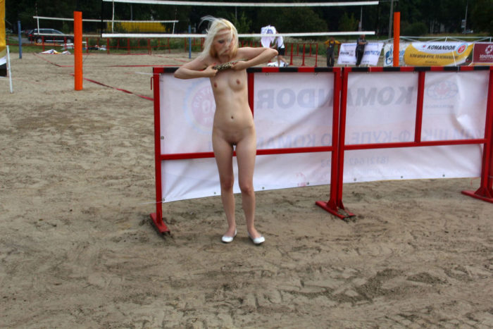 Blonde posing naked at public place