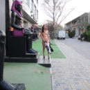 Young russian girl walks naked at resort town