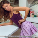 Kalisy strips her purple skirt baring her trimmed pussy in the kitchen.