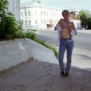 Short-haired blonde with perky boobs at varous public places
