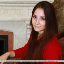Stefany Sonri bares her sexy body as she strips by the chimney.