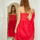 Layna looks absolutely stunning in an off-shoulder red dress and matching peep-toe stilettos.