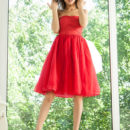 Layna looks absolutely stunning in an off-shoulder red dress and matching peep-toe stilettos.