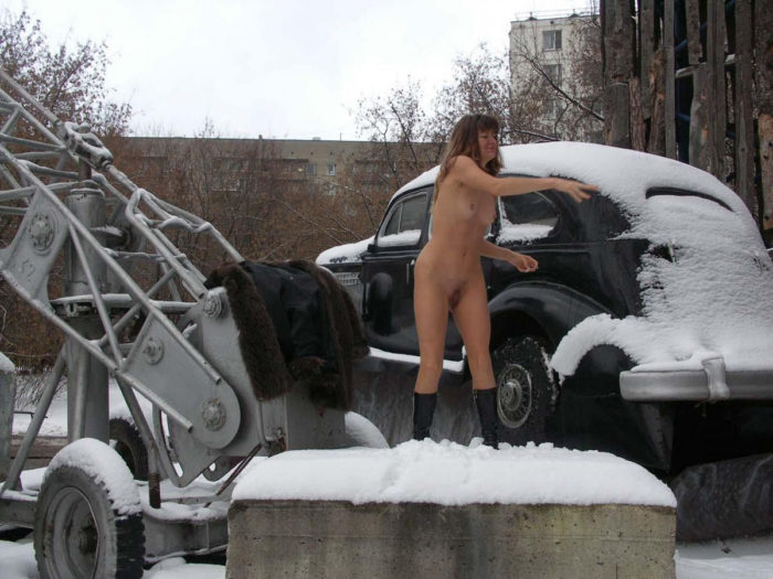 A girl who likes to walk naked in a snow-covered city