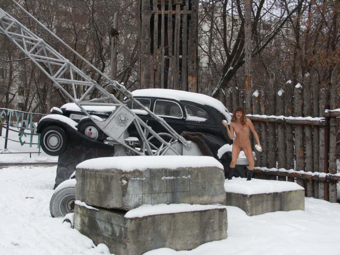 A girl who likes to walk naked in a snow-covered city